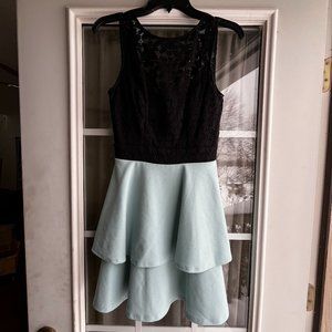 A never been worn size 3 light blue and black short dress.